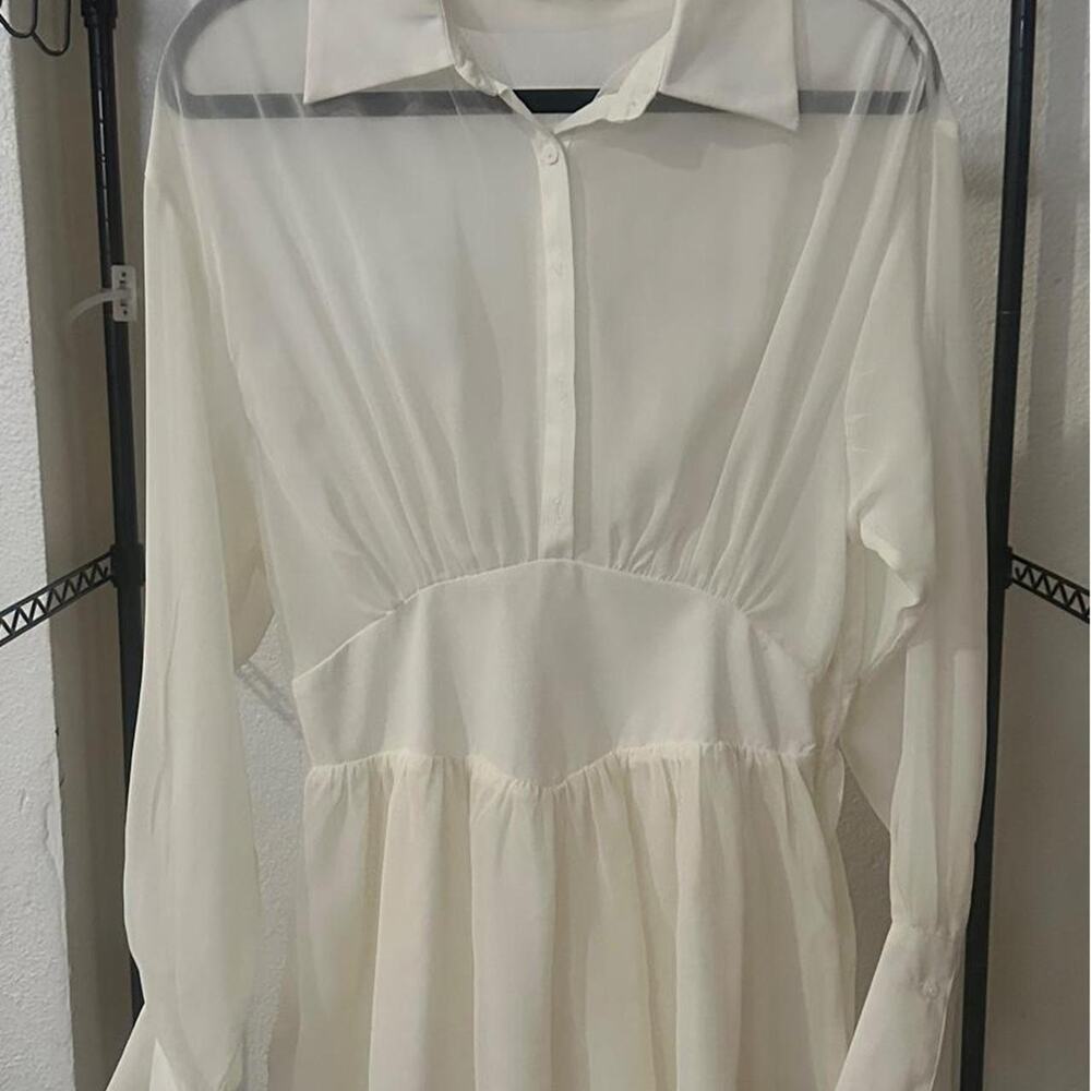 Naked wardrobe ivory sheer peplum